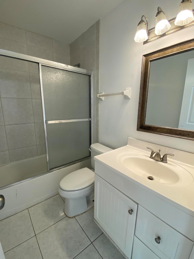 full bathroom with vanity, toilet, and enclosed tub / shower combo