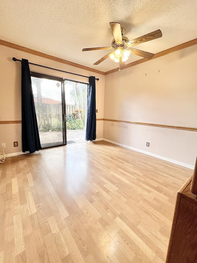 unfurnished room featuring ceiling fan, a textured ceiling, light hardwood / wood-style flooring, and crown molding