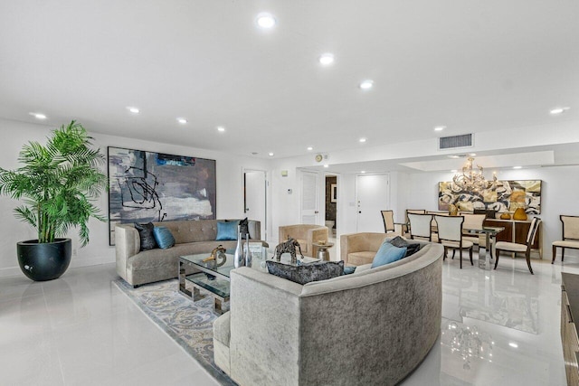 living room featuring a notable chandelier