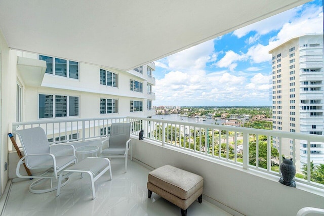 balcony featuring a water view