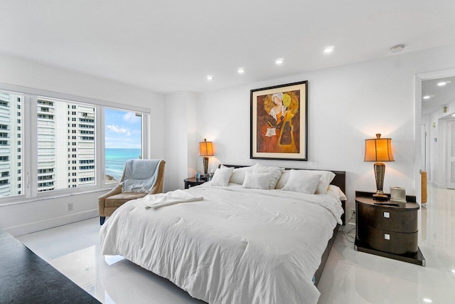 bedroom featuring a water view