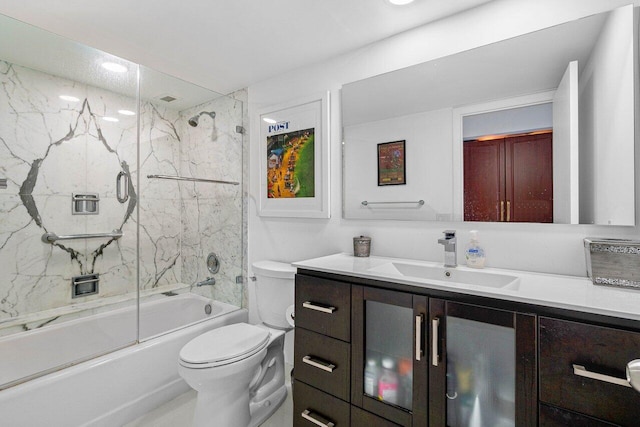 600 S Ocean Blvd Unit 1207, Boca Raton, FL 33432 - bathroom featuring vanity, toilet, and bath / shower combo with glass door