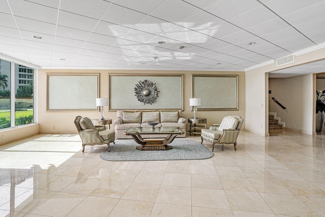 600 S Ocean Blvd Unit 1207, Boca Raton, FL 33432 - living area with stairs, baseboards, a paneled ceiling, and crown molding