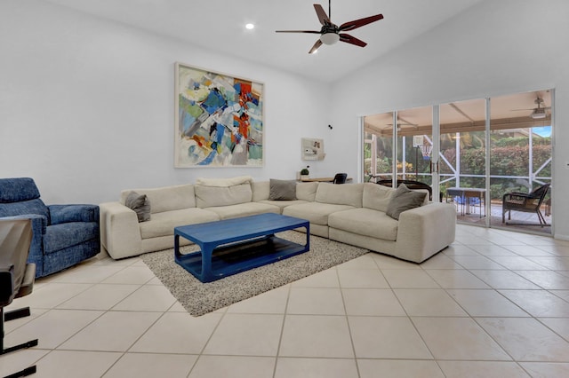 tiled living room featuring ceiling fan and high vaulted ceiling