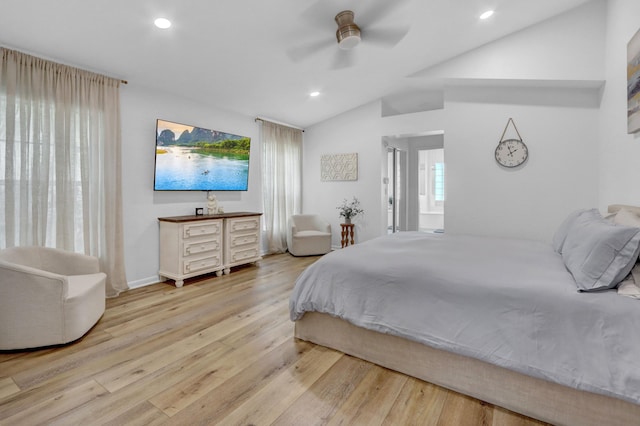 bedroom with light hardwood / wood-style flooring, ceiling fan, and vaulted ceiling