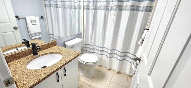 bathroom featuring vanity, toilet, a shower with curtain, and tile patterned flooring