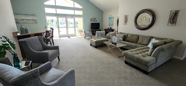 living room featuring high vaulted ceiling, carpet, and french doors