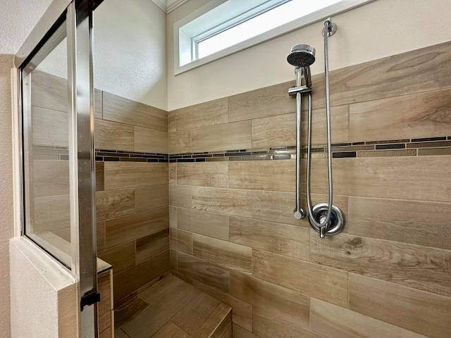 bathroom featuring tiled shower