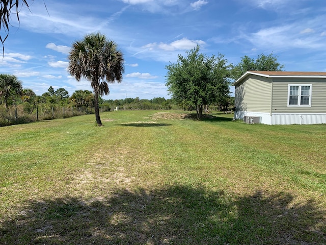 view of yard featuring central AC unit