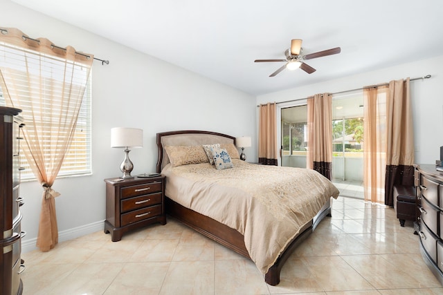 bedroom with light tile patterned floors, ceiling fan, and baseboards