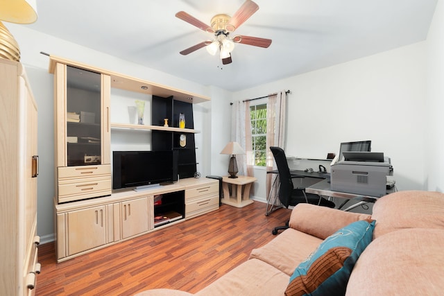 living room with a ceiling fan and wood finished floors