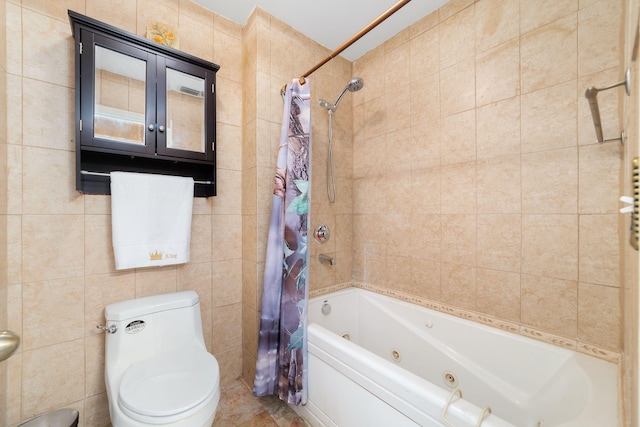 full bathroom featuring tile walls, toilet, and a combined bath / shower with jetted tub