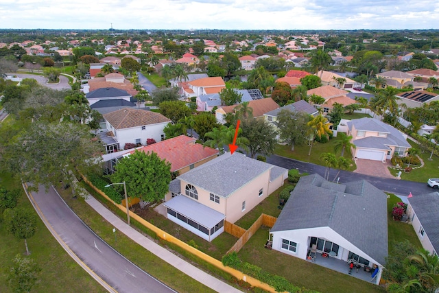 birds eye view of property with a residential view