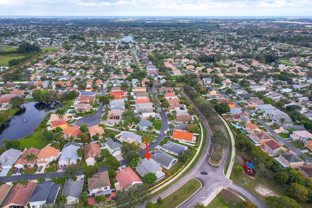 aerial view featuring a residential view and a water view