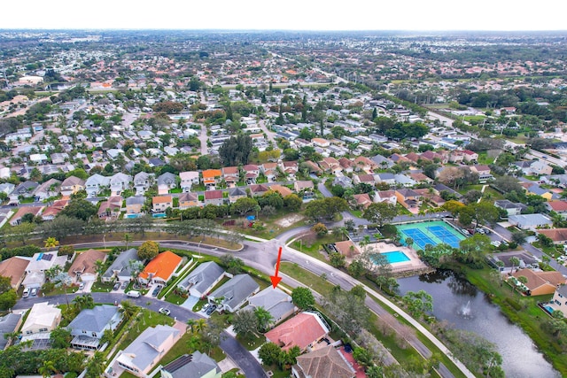 birds eye view of property with a residential view and a water view