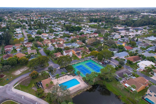 birds eye view of property with a residential view and a water view