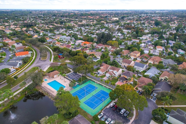 birds eye view of property with a residential view and a water view