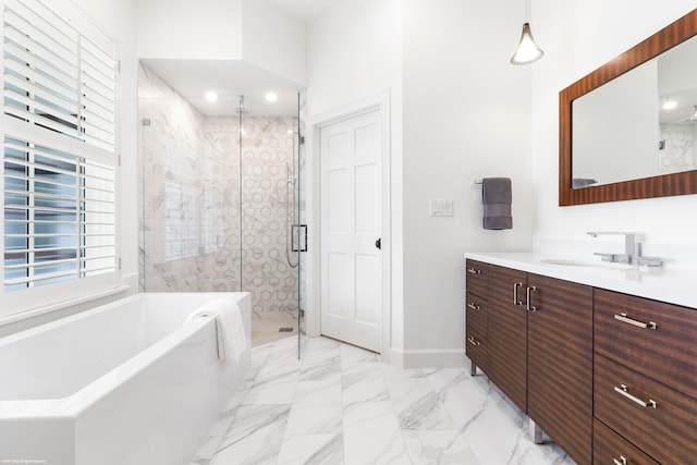 bathroom featuring vanity and separate shower and tub