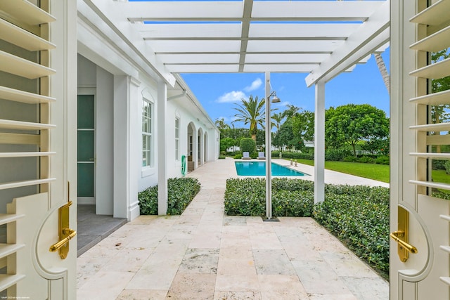 view of swimming pool featuring a pergola and a patio area