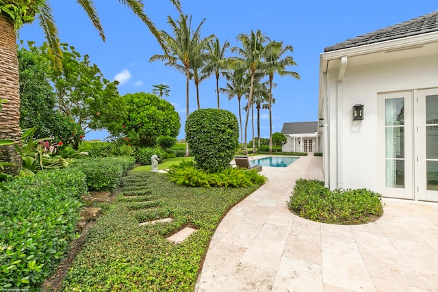 view of yard with a patio area and french doors