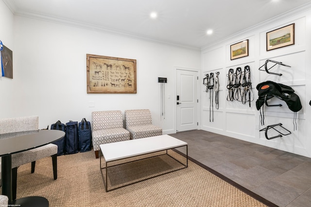 interior space with dark tile patterned flooring and crown molding