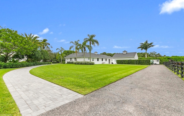 ranch-style house featuring a front yard