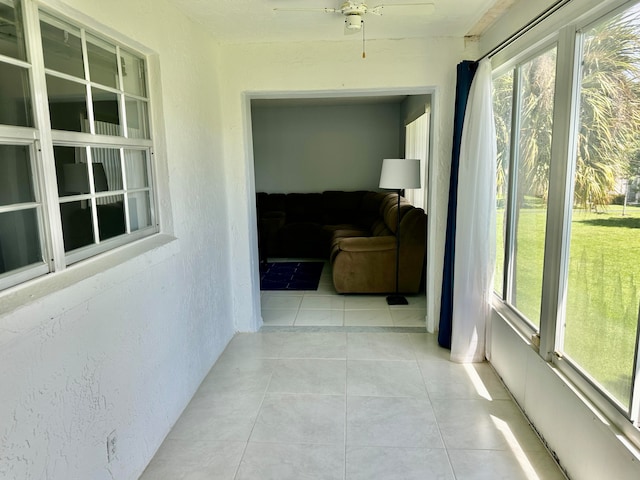 hall with light tile patterned floors