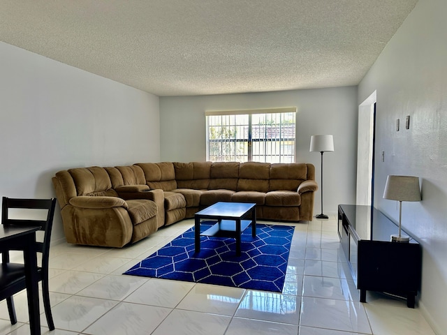 living room featuring a textured ceiling and tile patterned floors