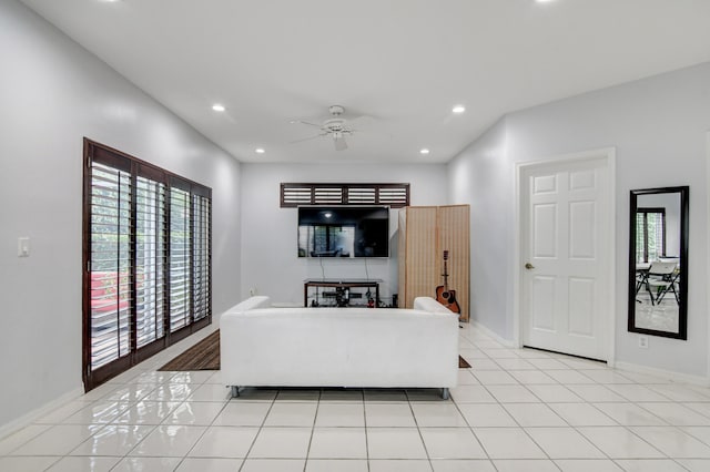 living room with light tile patterned floors and ceiling fan