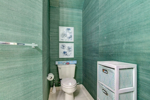 bathroom with toilet and tile patterned floors