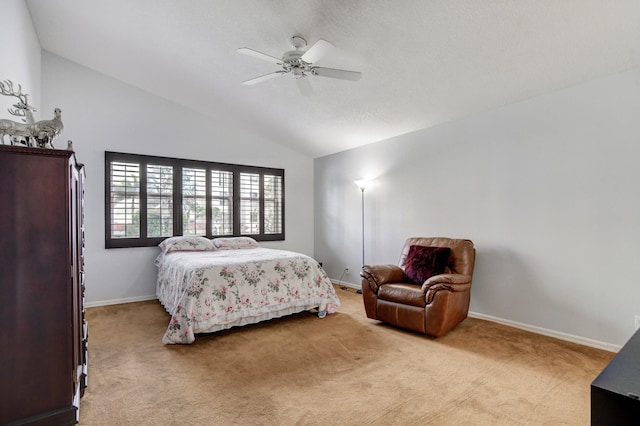 bedroom with ceiling fan, light carpet, and lofted ceiling