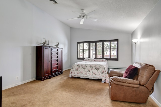 carpeted bedroom with lofted ceiling, a textured ceiling, and ceiling fan