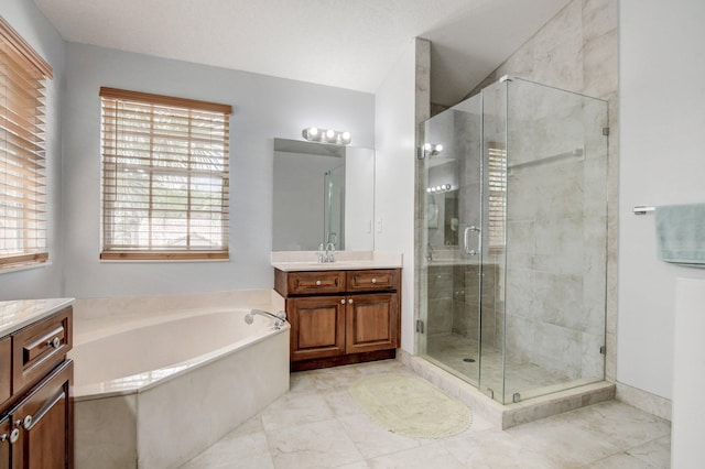 bathroom featuring vanity and plus walk in shower