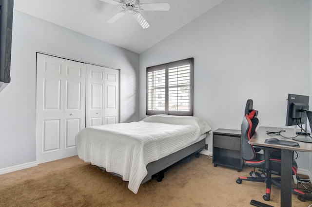 bedroom featuring carpet, vaulted ceiling, a closet, and ceiling fan