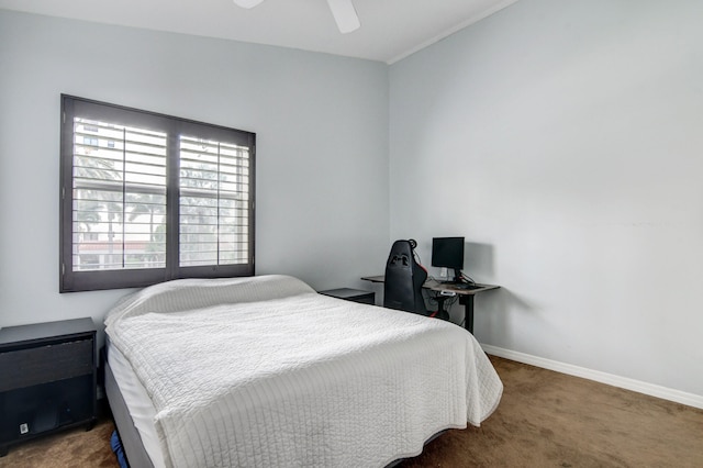 bedroom featuring ceiling fan and dark colored carpet