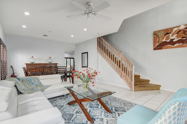 living room with ceiling fan and light tile patterned flooring