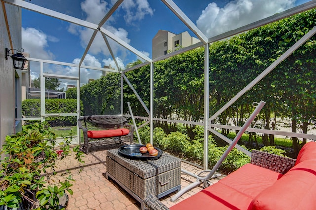 view of patio featuring a lanai