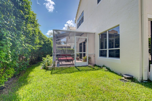 view of yard with a patio area and a lanai