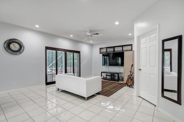 living room featuring ceiling fan and light tile patterned flooring