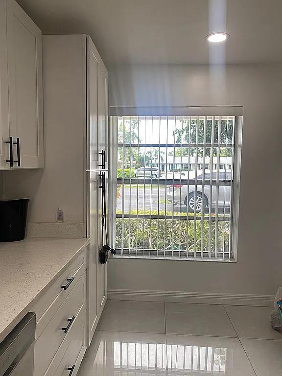 interior space featuring light tile patterned floors