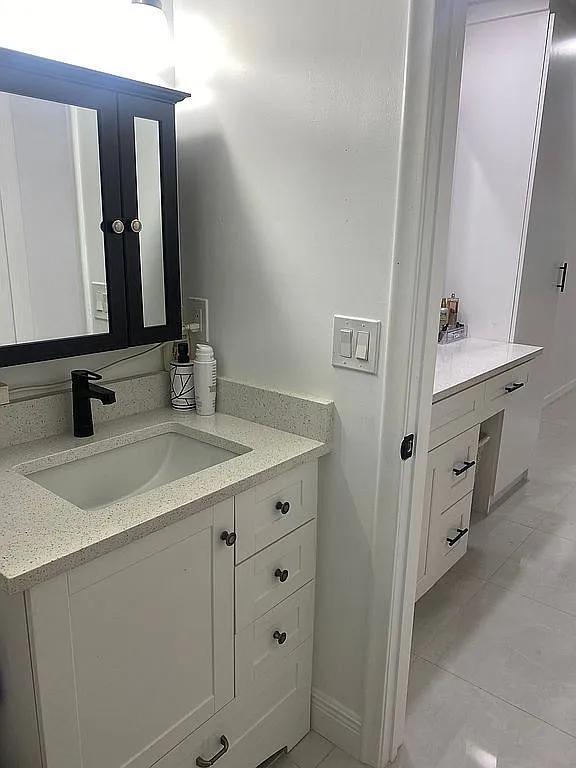 bathroom with vanity and tile patterned floors