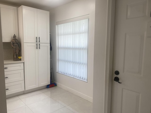 interior space with light tile patterned flooring