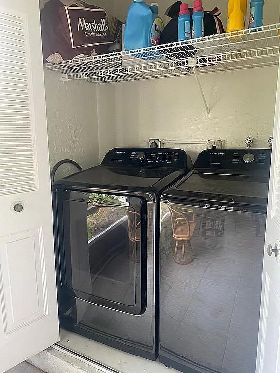 laundry area with independent washer and dryer