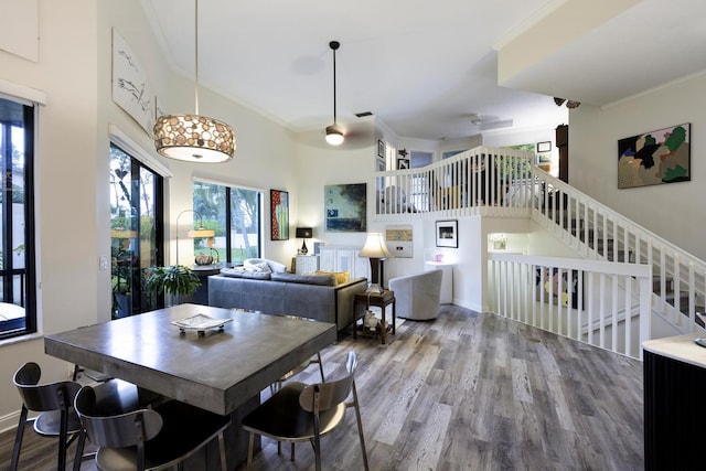 dining room with wood-type flooring and ornamental molding