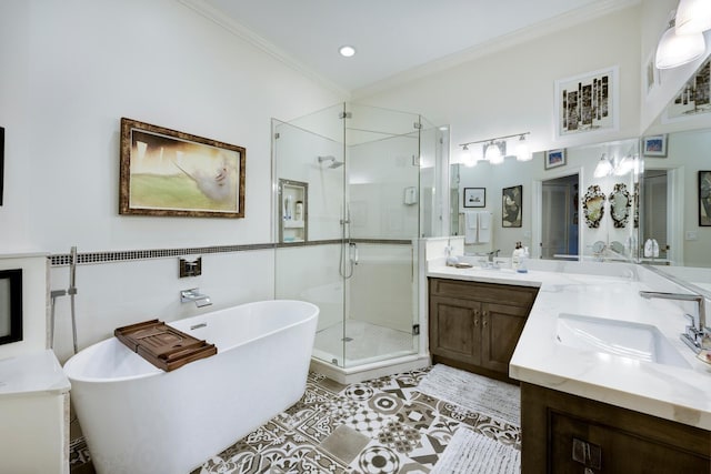 bathroom featuring tile patterned flooring, vanity, separate shower and tub, and ornamental molding