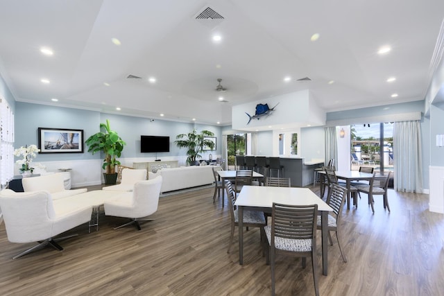 dining area featuring ceiling fan, crown molding, and hardwood / wood-style flooring