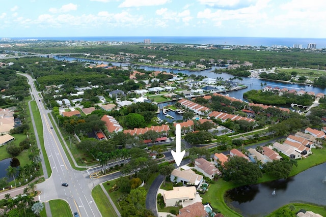 birds eye view of property featuring a water view