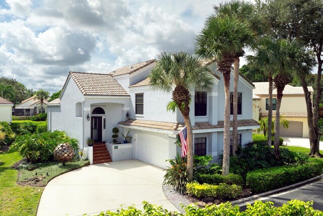 mediterranean / spanish-style house featuring a garage