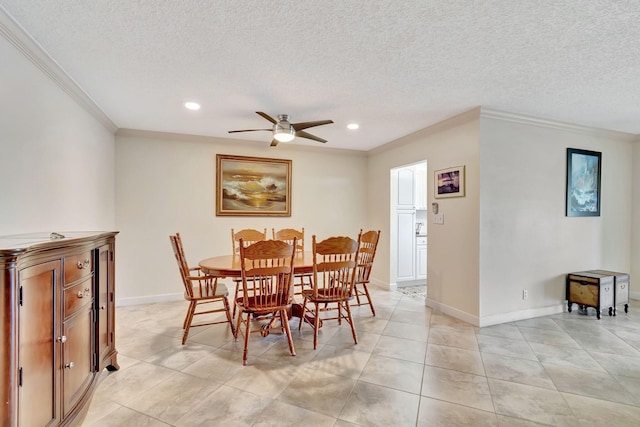 tiled dining room featuring a textured ceiling, crown molding, and ceiling fan