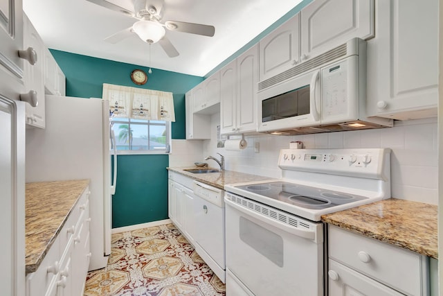 kitchen with ceiling fan, white cabinets, backsplash, and white appliances